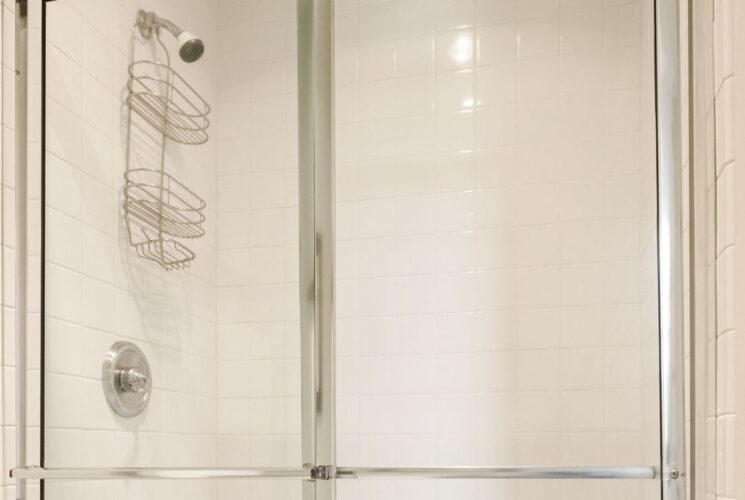 Bathroom with stand up shower with glass doors